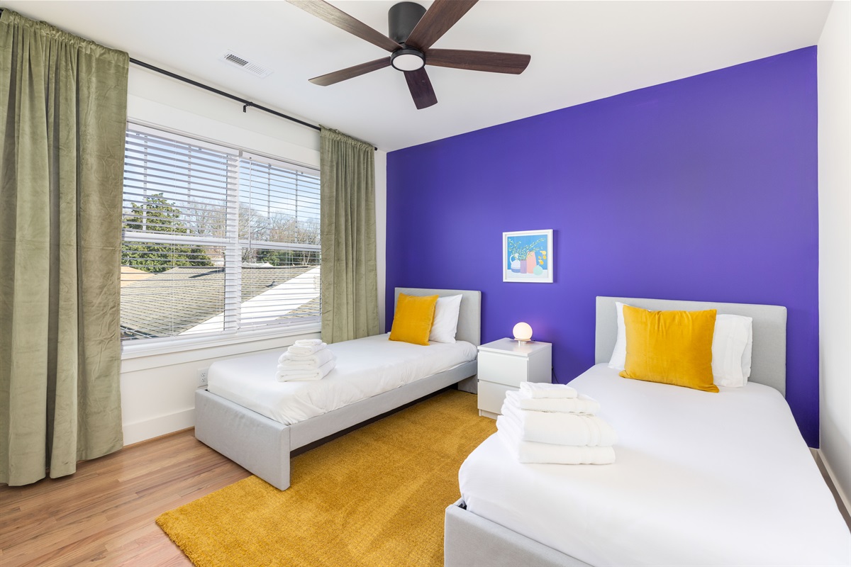This twin room is downstairs on the main floor and is adjacent to the half bathroom.