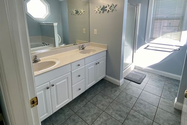 Master bathroom with shower, double vanity and jacuzzi tub