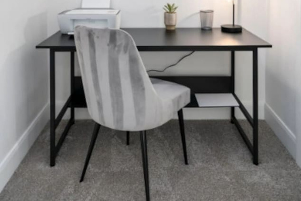 Dedicated office nook with desk, printer, and inspirational décor—perfect for remote work.