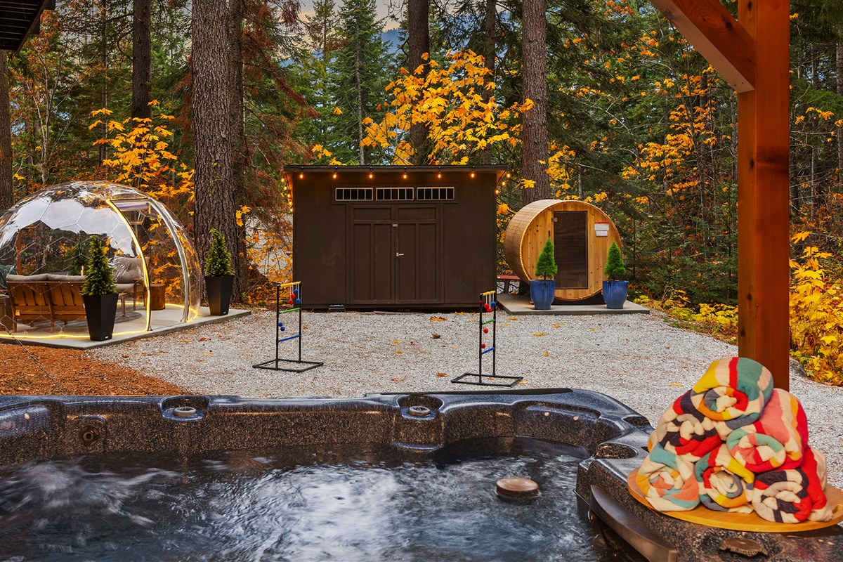 Backyard: Geo dome, covered hot tub and barrel sauna
