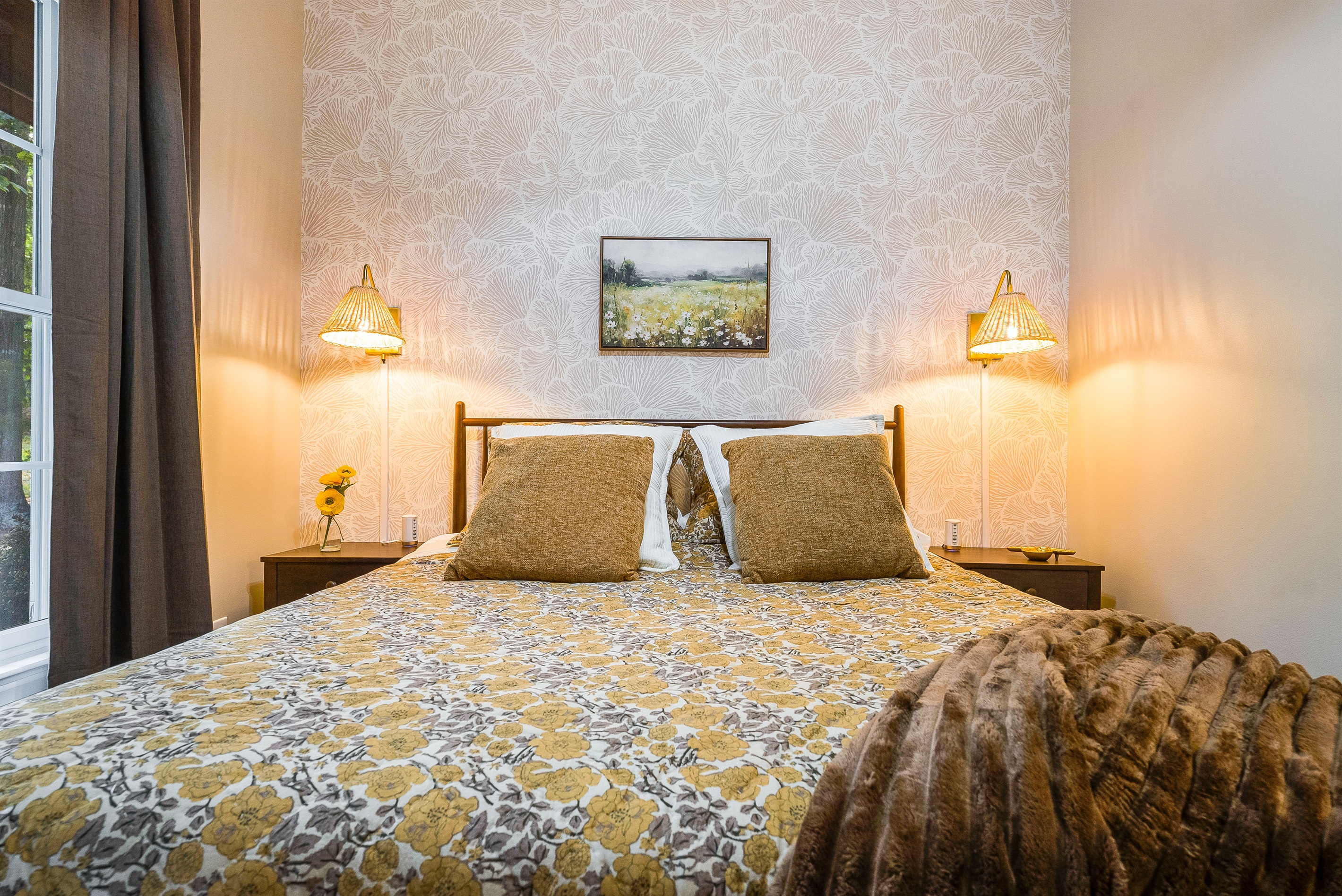 Thoughtful touches and cozy lighting create a peaceful bedroom you’ll love waking up in.