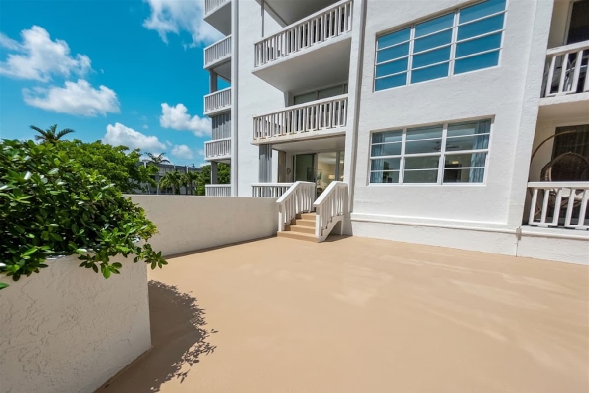 Step directly from your private balcony to the pool and beach—this rare ground-floor walk-out puts the sand and amenities just minutes from your door.