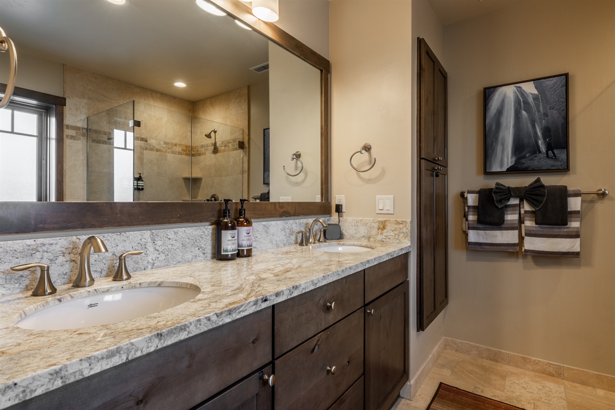 Dual vanities and beautiful natural light create a bright, spacious primary bath retreat.