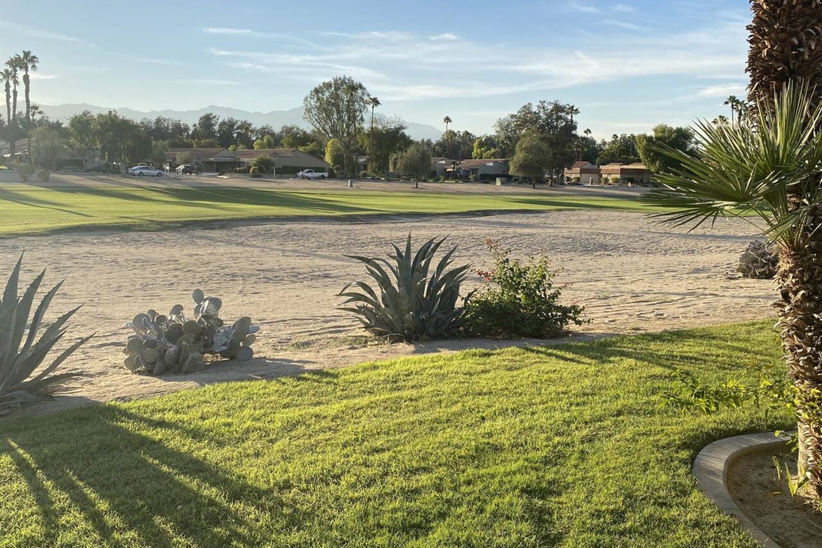 The west facing patio views of the 10th fairway with beautiful  mountains in the distance and ...  