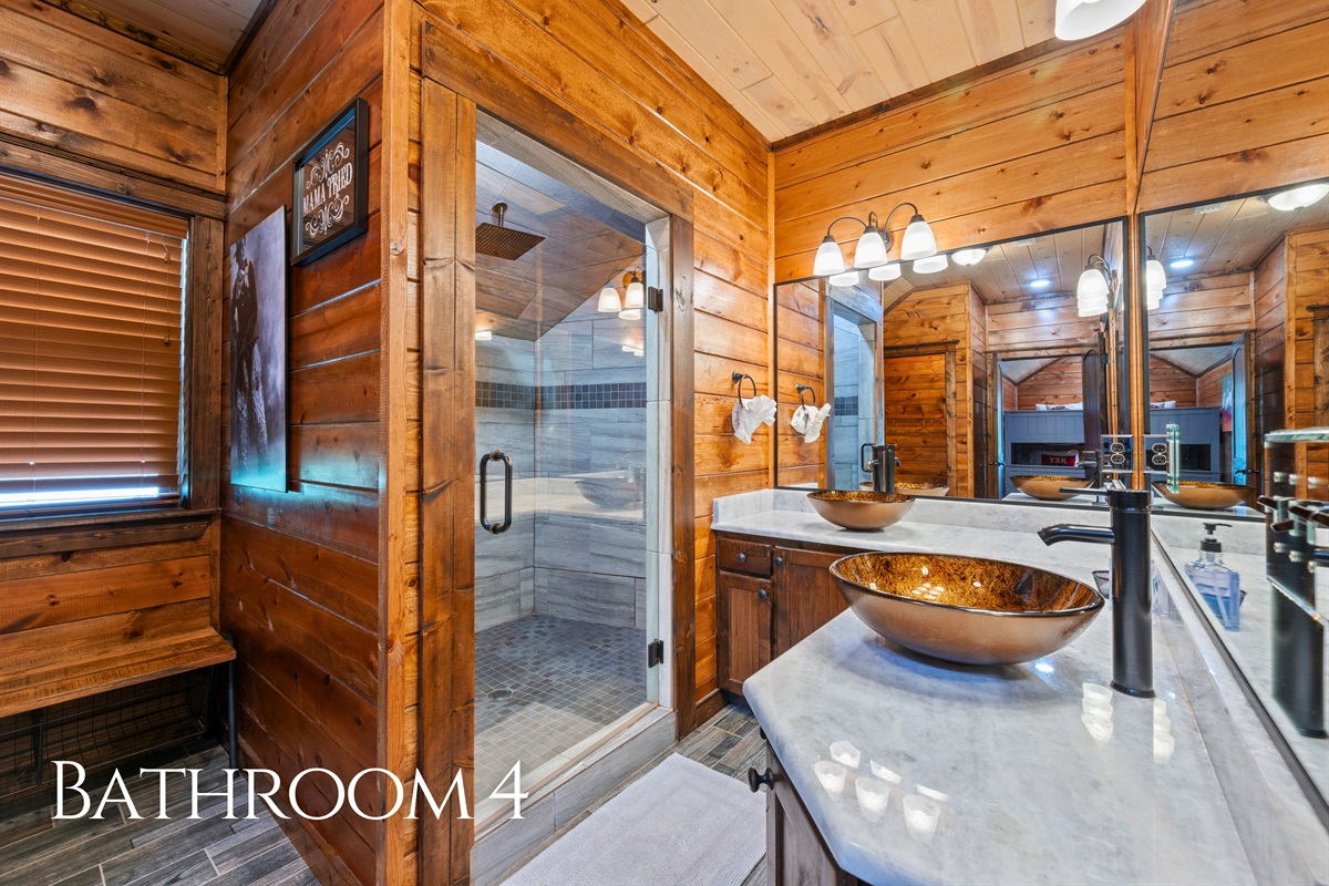 The shared bathroom on this level features double sinks and plenty of counter space, making it convenient for multiple guests to get ready at the same time.