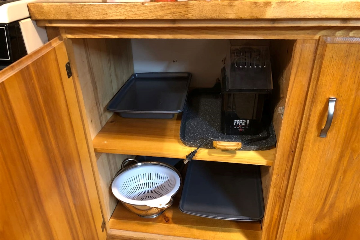 Cake pan, cookie sheets, large 2-burner griddle, air popcorn maker and colanders. 