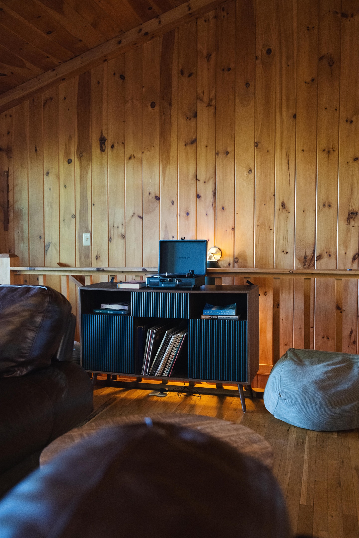 A record player adds a nostalgic touch set the tone with soft music and unwind in true mountain cabin style.