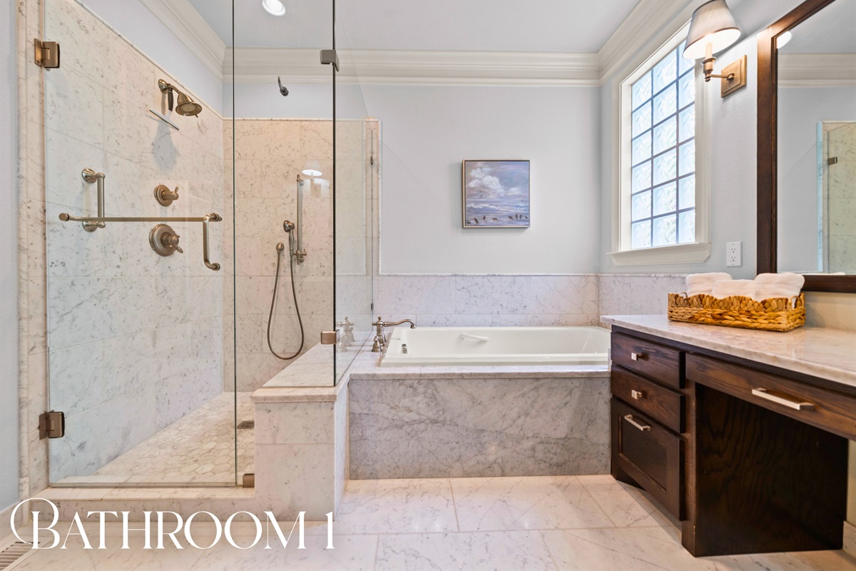 Bathroom 1: Spa-inspired with a walk-in shower and soaking tub &mdash; luxury made easy.