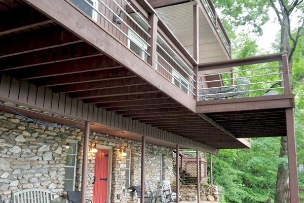 Exterior Retreat: Wrap around porches and stone accents welcome you to nature's embrace!