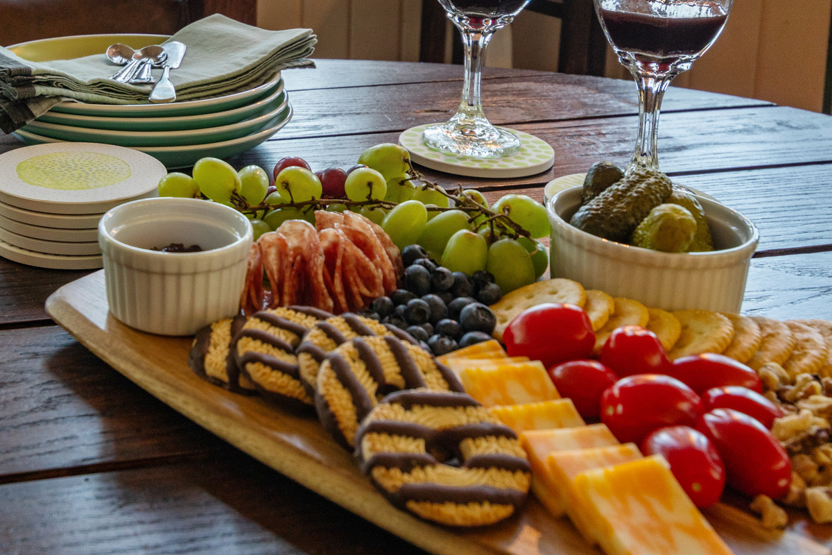 Set out your favorite snacks, pour a drink, and settle in—because some of the best vacation memories are made gathered around good food with the people you love.