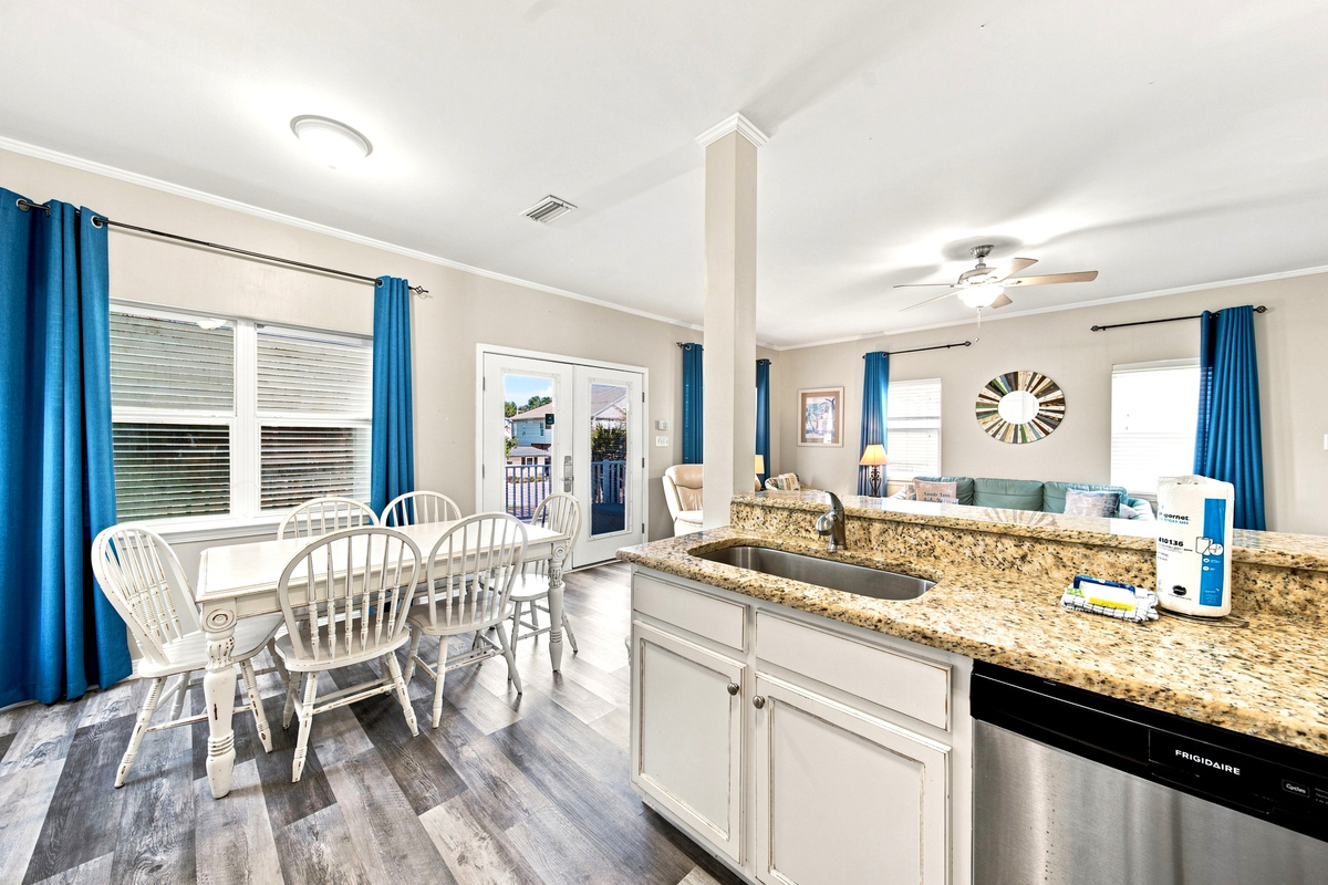 Gather the whole group around the dining table for family dinners or game night after a day at the beach.
