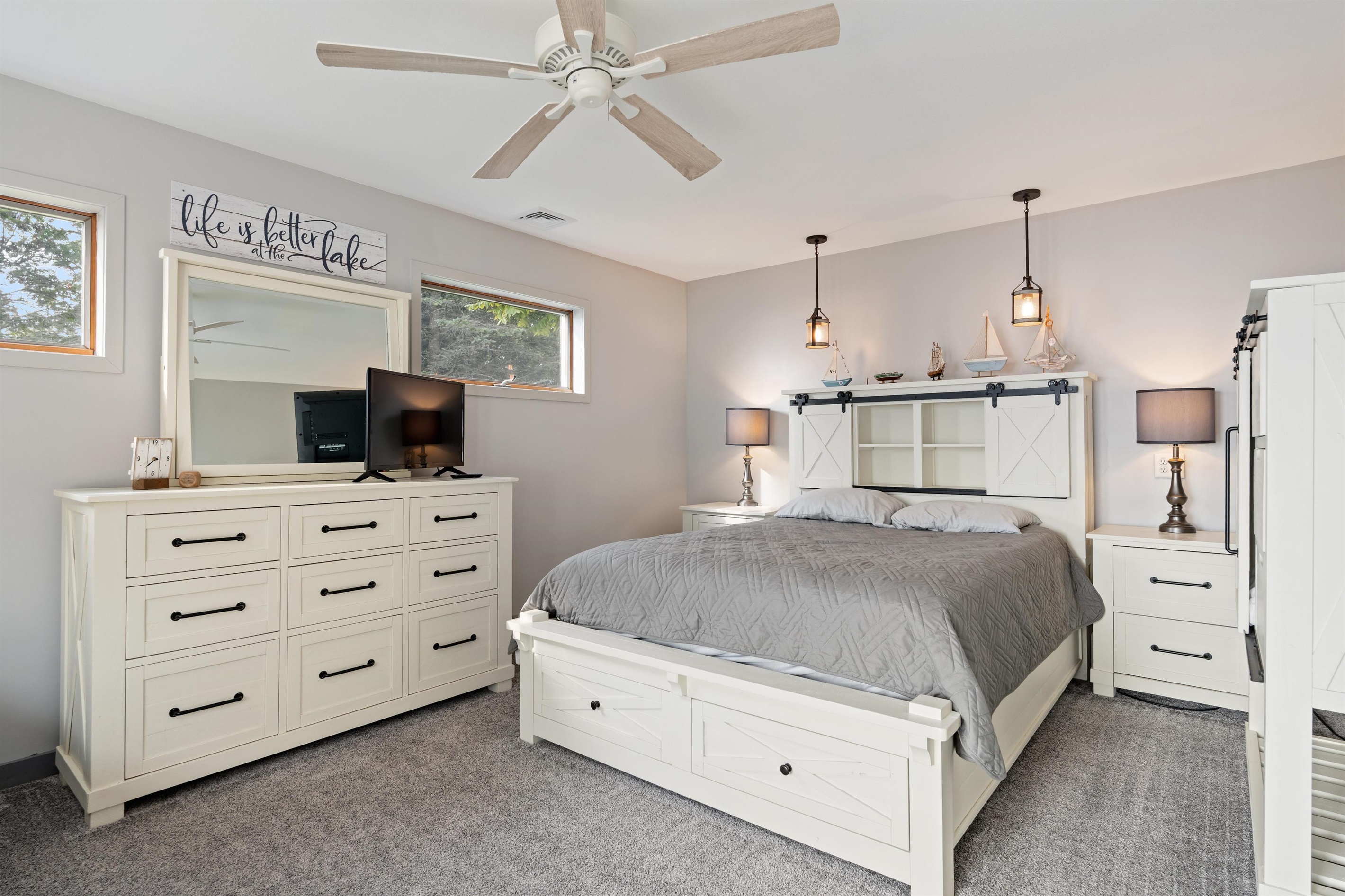 Primary bedroom with private bathroom and lake view walkout