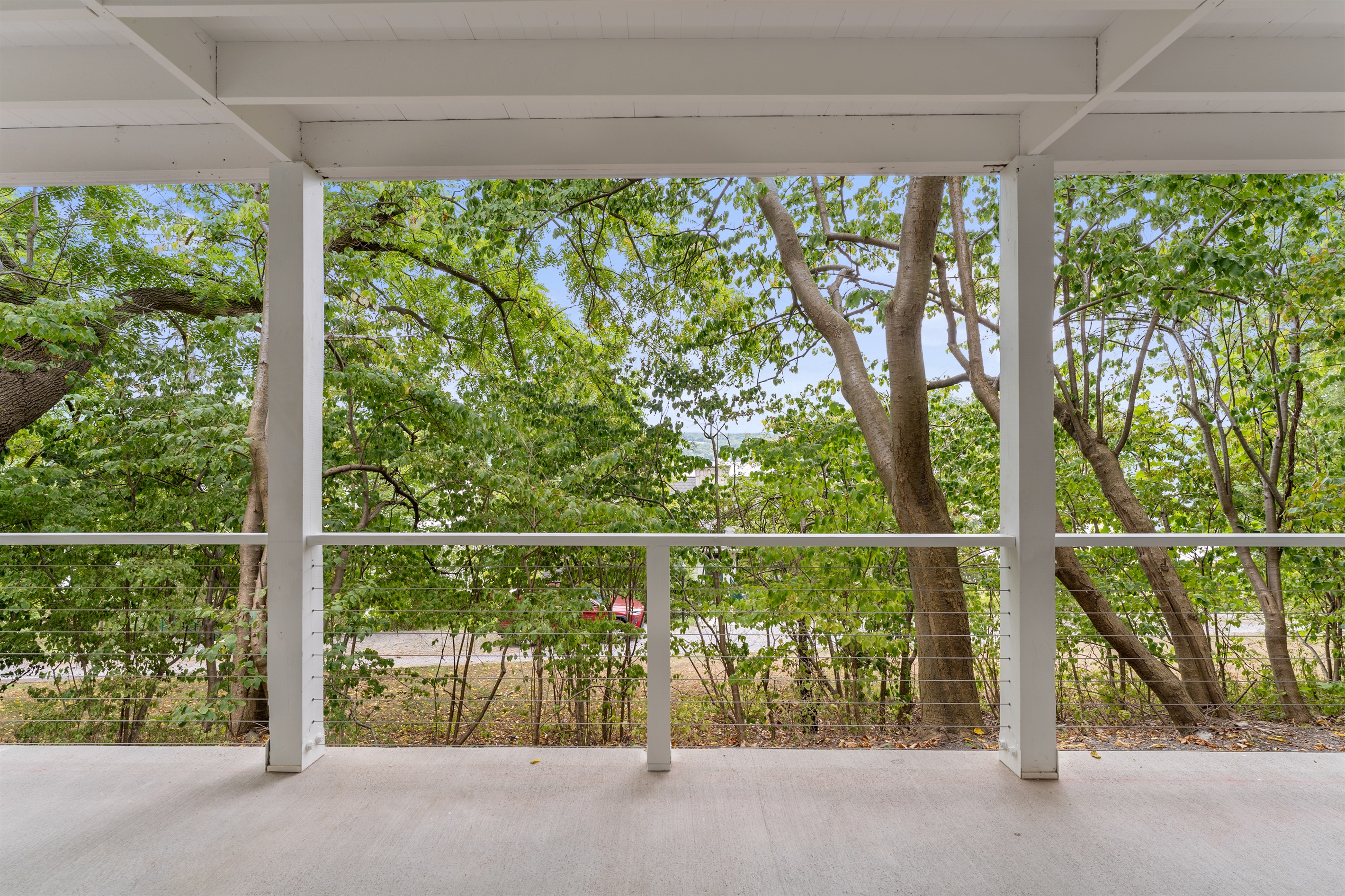 Spacious covered porch perfect for morning coffee or evening gatherings rain or shine.