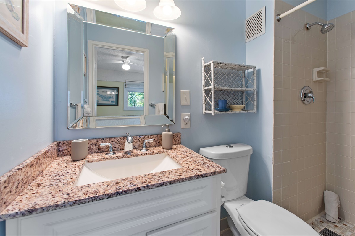 Ensuite full bathroom to the queen bedroom off the kitchen.