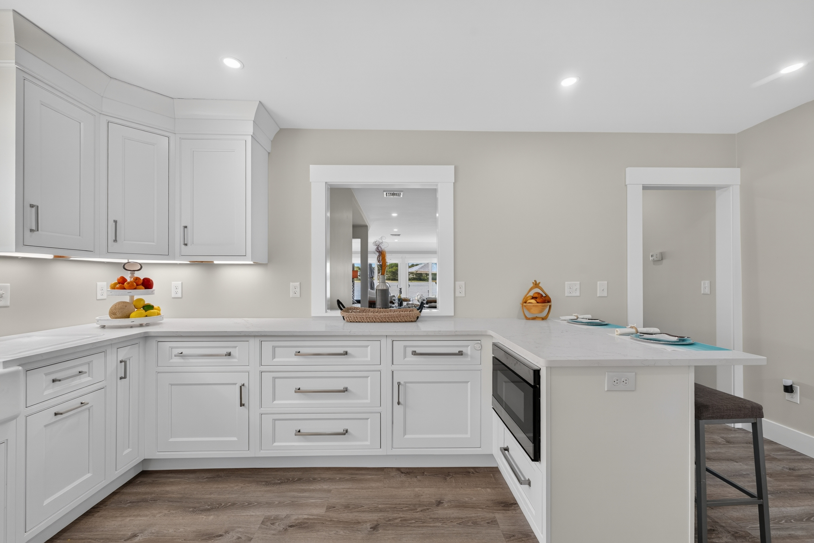 Expansive kitchen with abundant cabinetry, large island, and plenty of room to cook together.