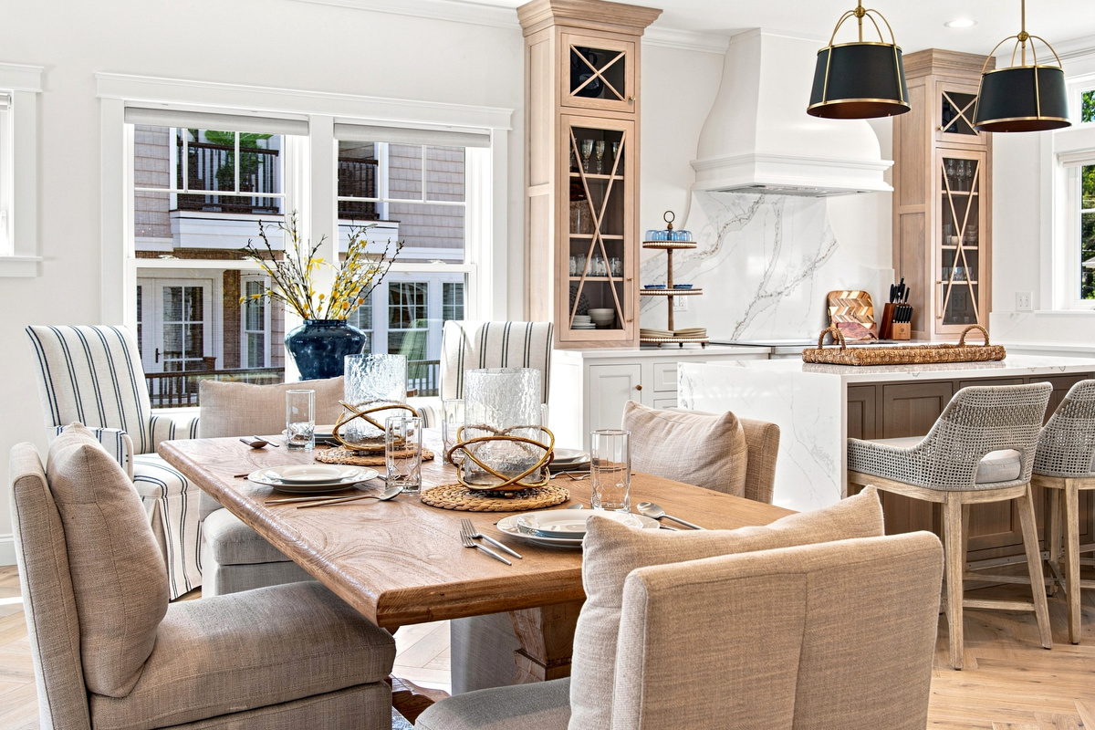 Gather around the dining table for memorable meals in a bright, open kitchen and dining space.