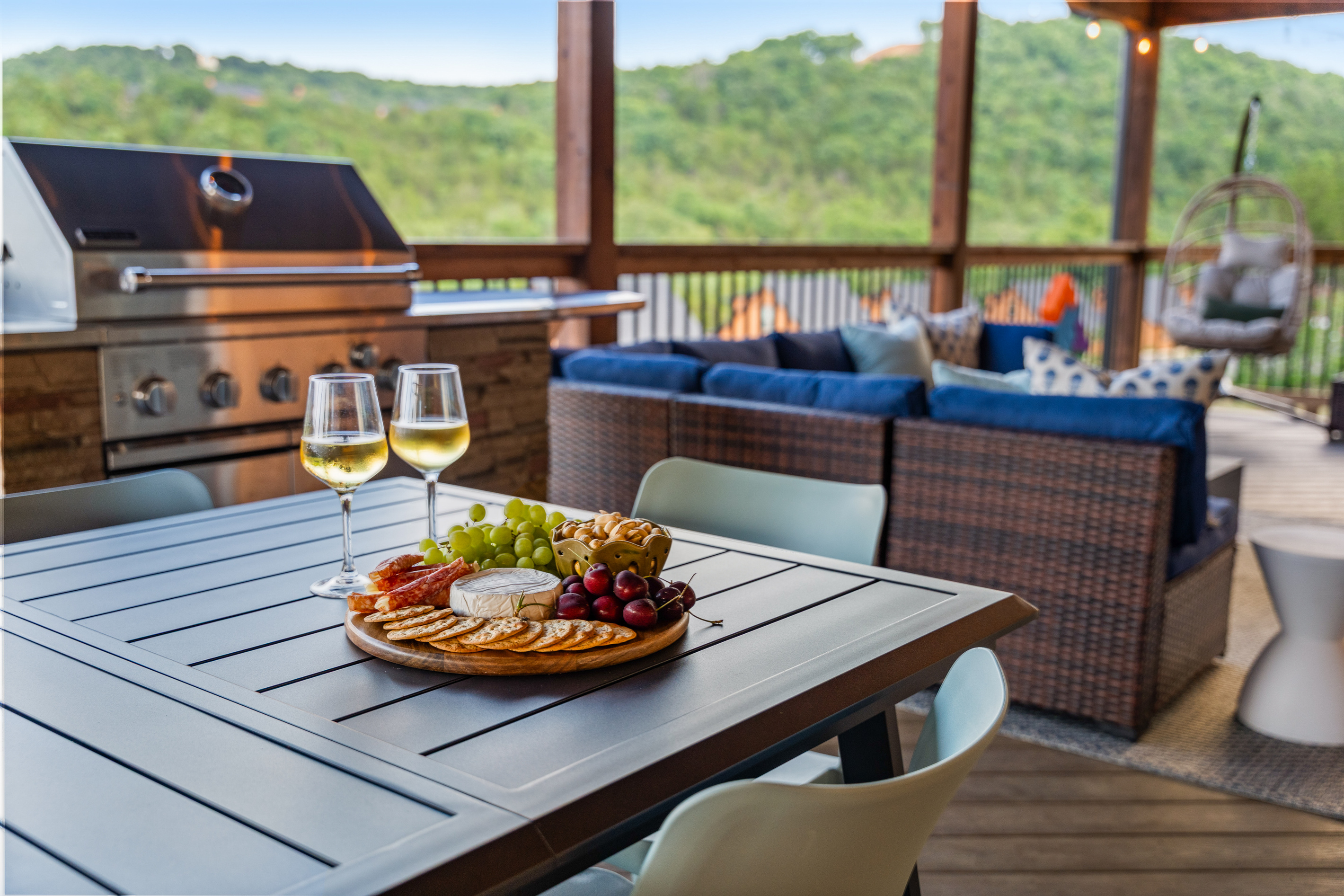 Two glasses of white and a loaded board – dinner with an Ozark view, no reservation needed.