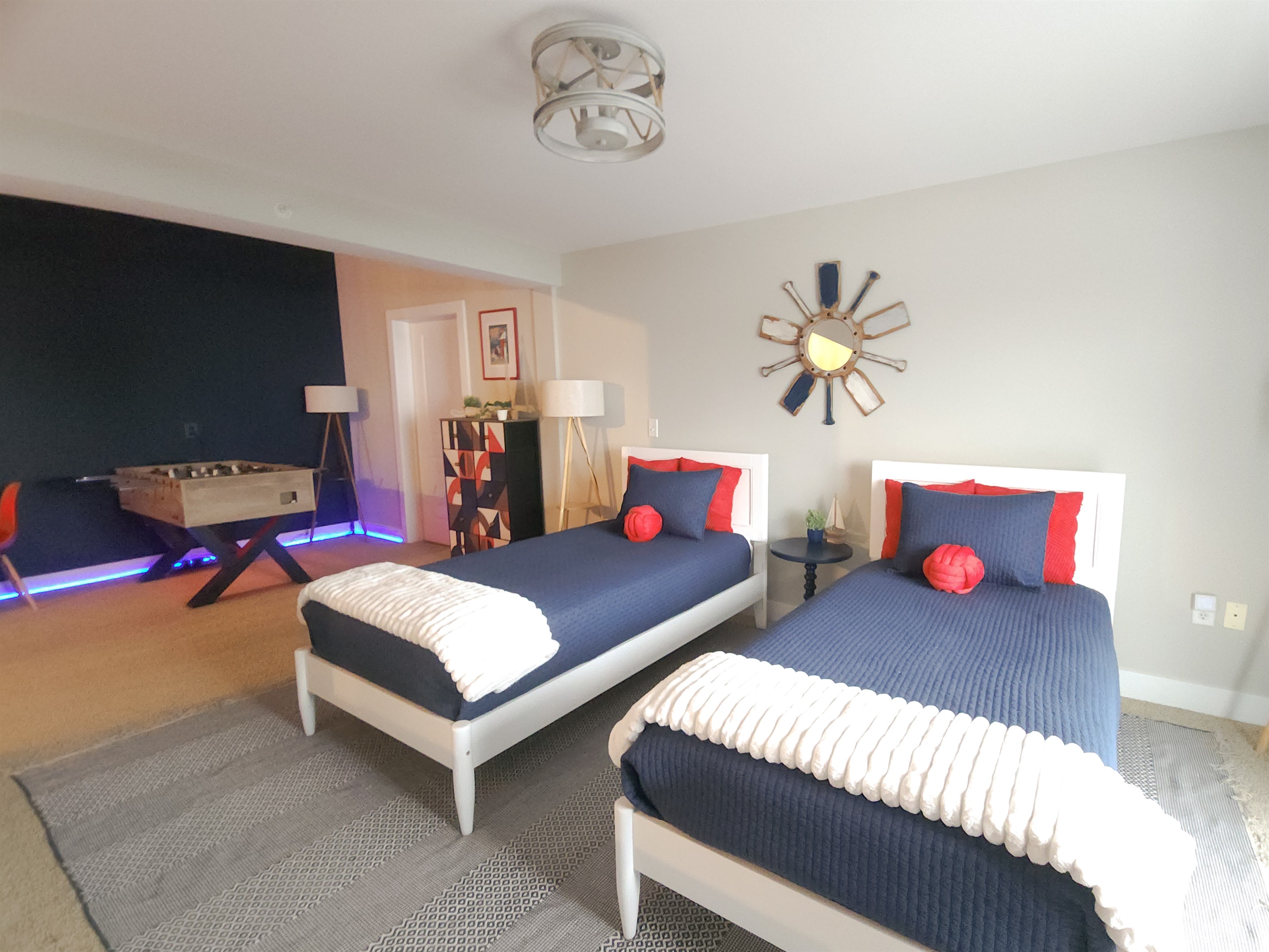 Kids sleeping area with 2 twins, adjacent to gaming area.