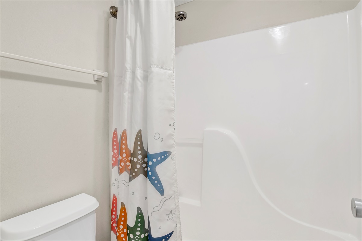 En-suite bathroom with granite tops and a water closet with tub/shower combo 