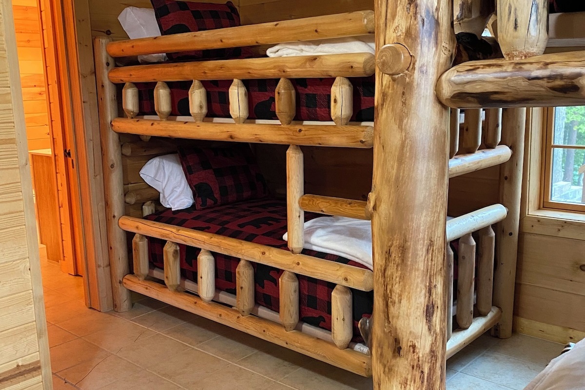 bedroom #6 twin bunks and door to bathroom.
