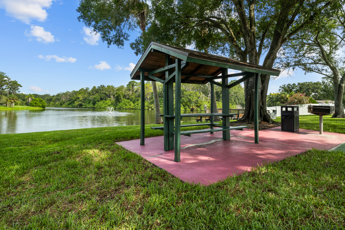 The recreation area table seating overlooks the water.