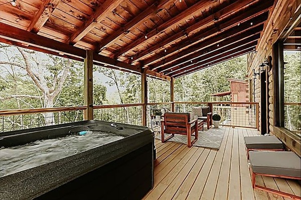 Enjoy a warm soak in the private hot tub while you listen to the breeze move through the trees