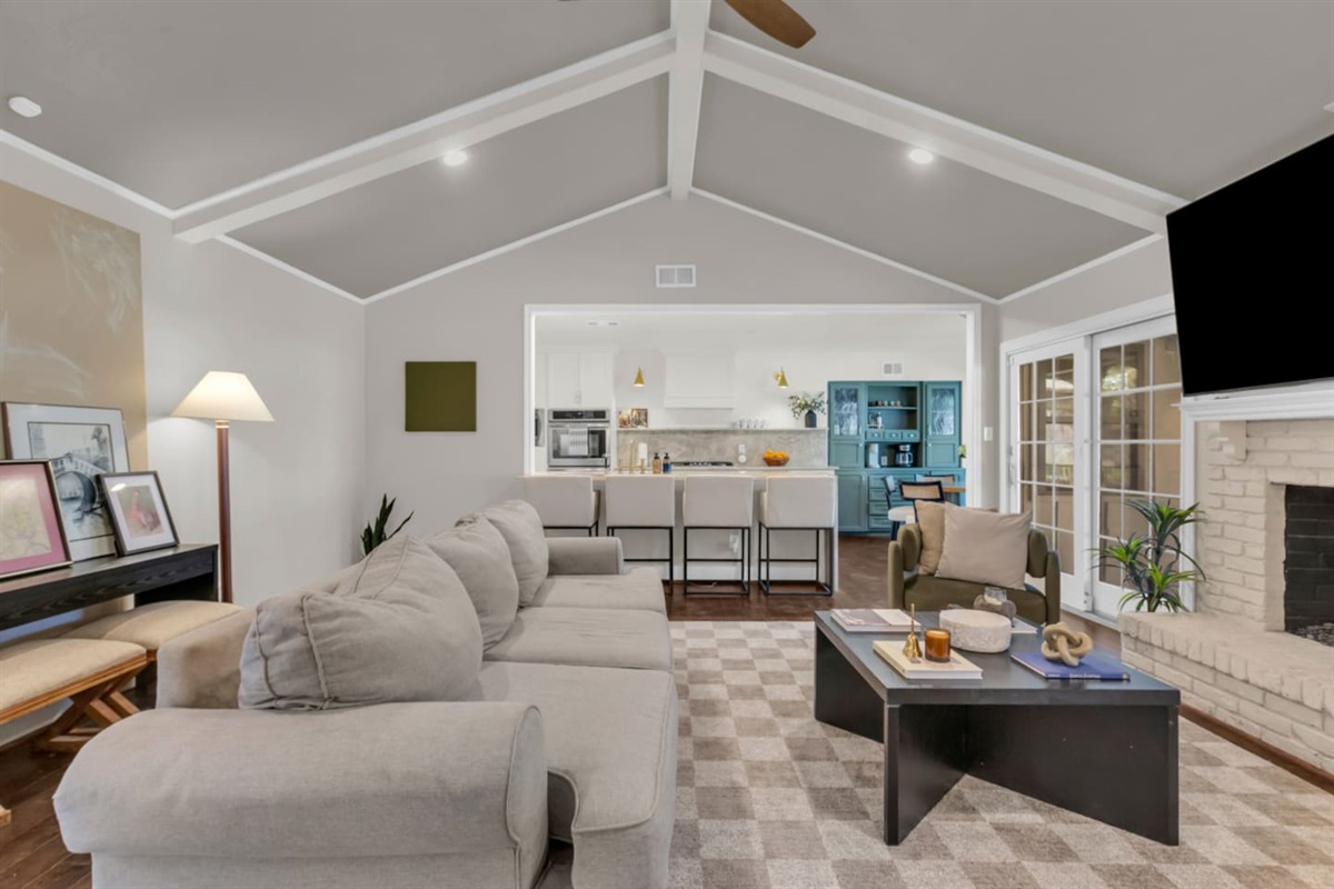 Open-concept living room offering a bright, spacious layout that flows seamlessly into the kitchen and dining areas for comfortable group living.