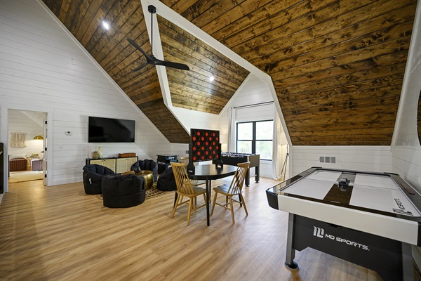 Gameroom with foosball and air hockey