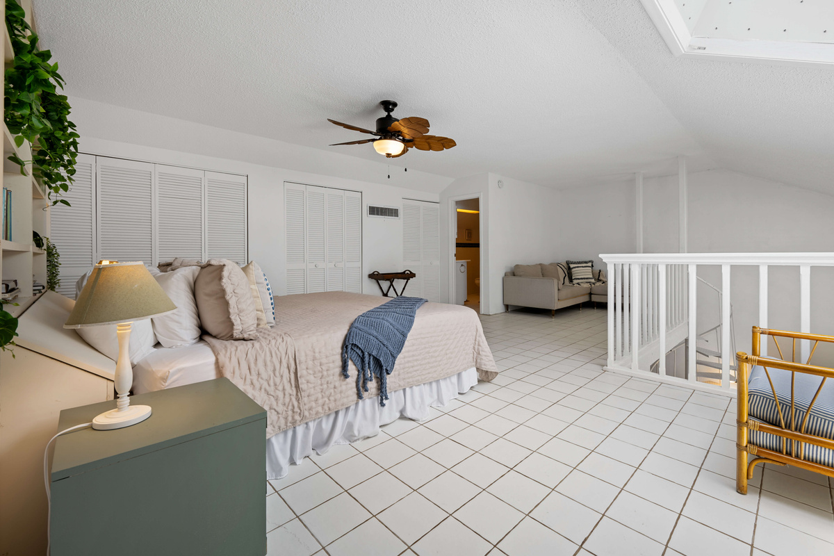 The loft bedroom offers a unique and cozy retreat overlooking the main living area.