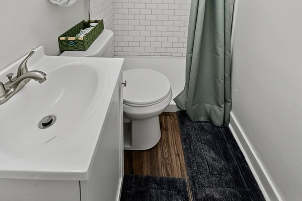 Small bathroom with all the essentials, including a walk-in shower (no tub)