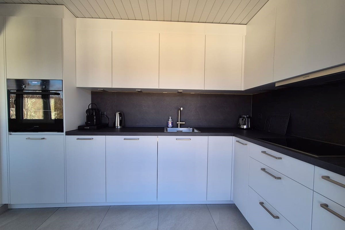 The kitchen is large and has lots of storage space.
