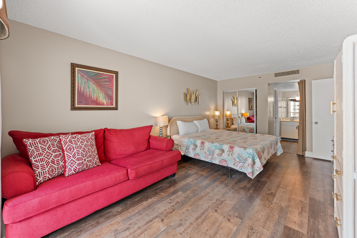 Spacious Main bedroom with King bed, balcony access, ensuite and a sofa bed.