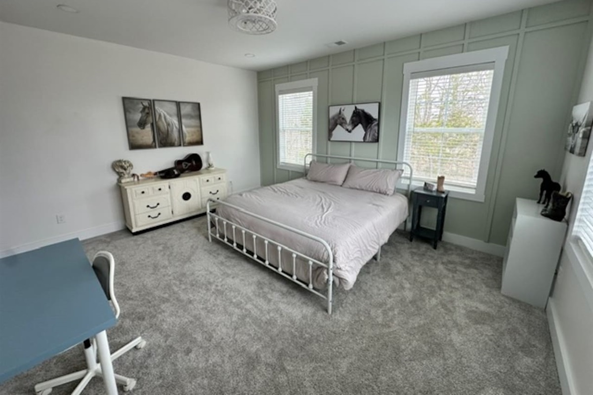 Welcome to Kentucky! This western-themed room is definitely a taste of the bluegrass. Private sink and makeup vanity with shared access to private toilet and shower with bedroom #4. Desk and chair available.