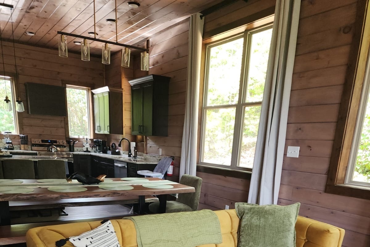 Dining area and fully equipped kitchen — designed for group meals and entertaining.
