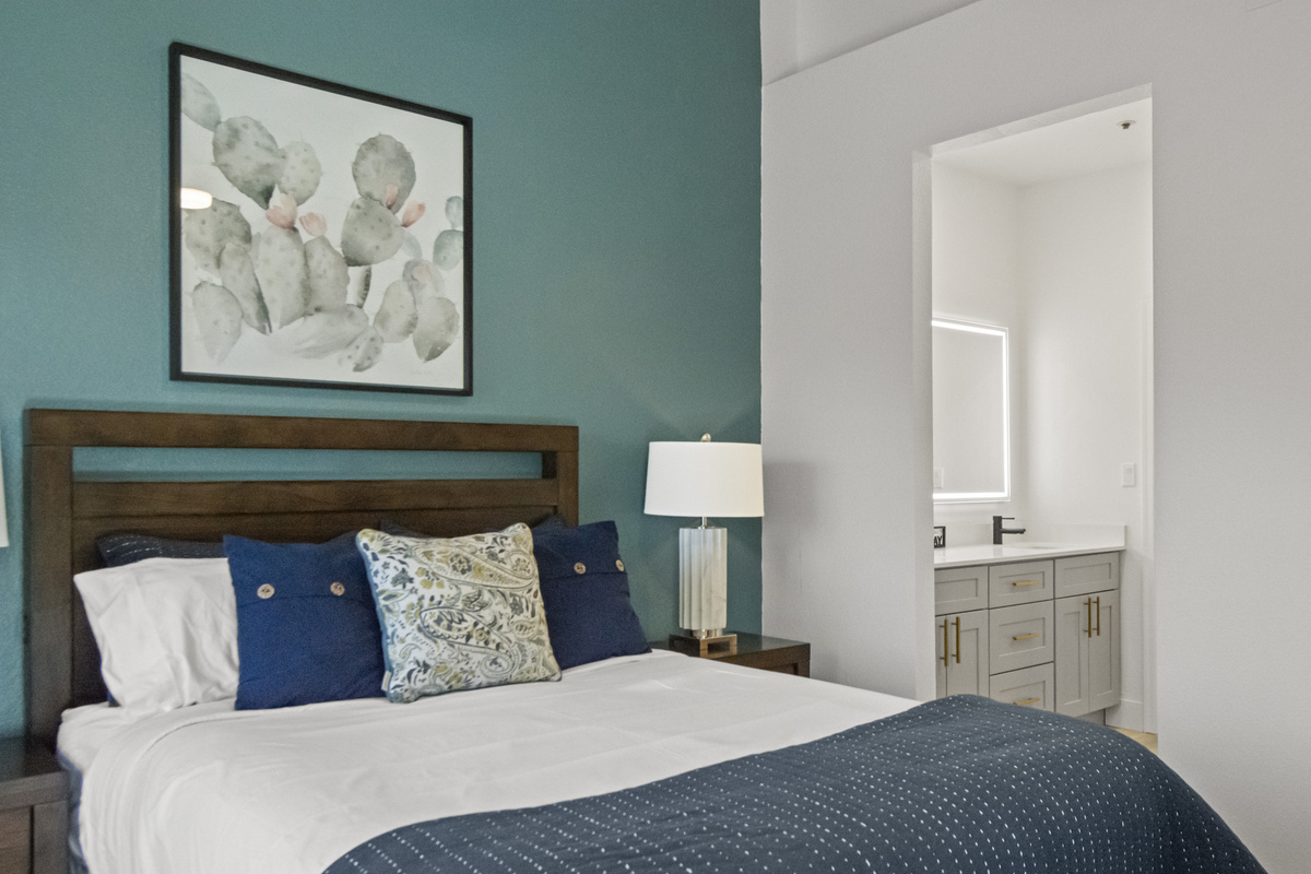 Inviting bedroom featuring a comfortable bed, soft linens, and a calming color palette for a restful night.