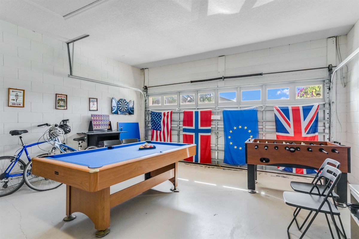 The game room has a pool table, foosball, air hockey and darts.