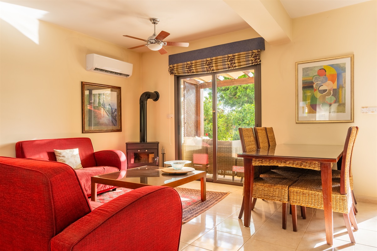 Relax in the cozy living room, complete with a wood-burning stove – perfect for adding both warmth and ambiance on winter nights.