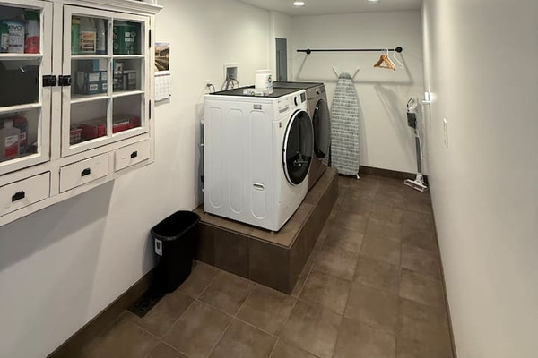 Large laundry/mud room with full access to the washer & dryer.  Laundry pods provided.