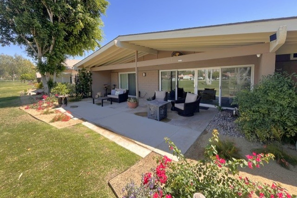 Three separate seating areas on extended rear patio.