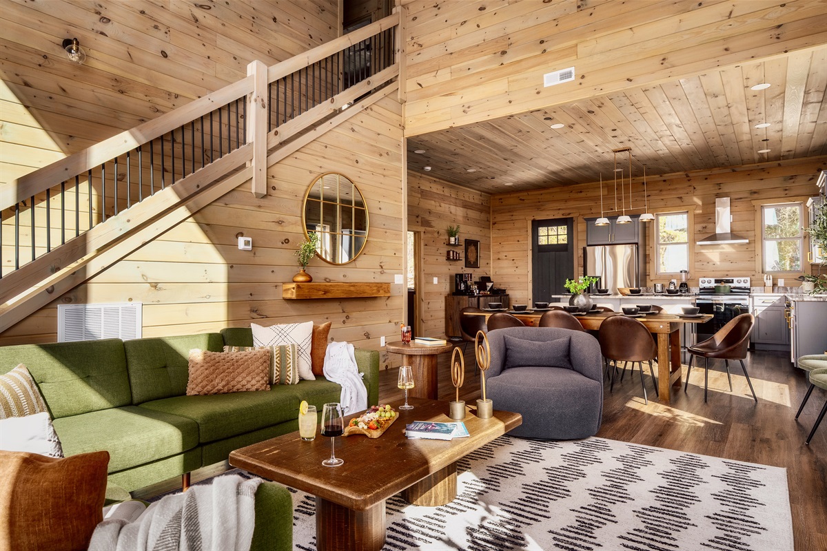 Open, airy living room with a warm cabin feel and space for everyone.