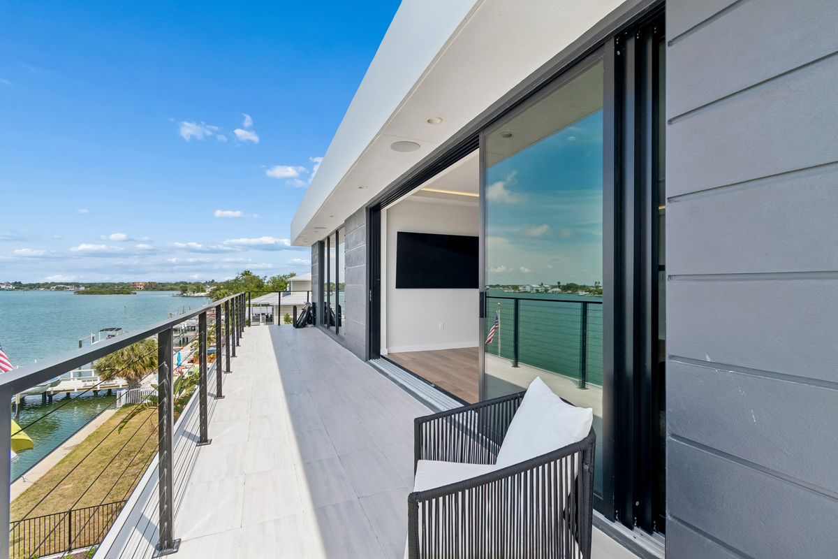 Enjoy the waterfront views from the primary suite balcony