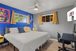 Executive Comfort Meets Relaxation 🛏️💼📺 – Experience the best of both worlds in our room with a king-sized bed, a desk and chair for work or study, and a smart TV for your leisure.