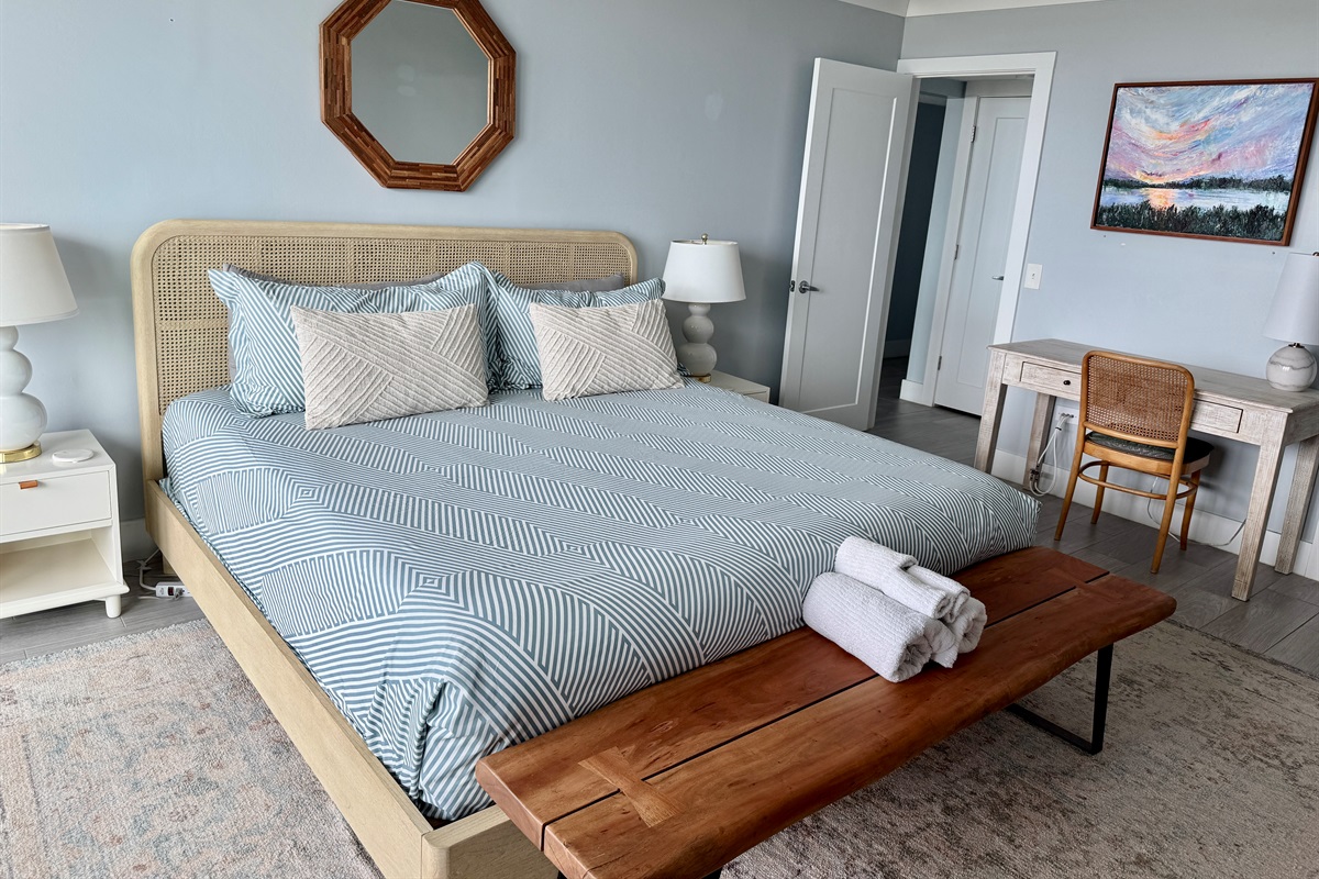 Primary Bedroom with Desk, TV, and En Suite Bath