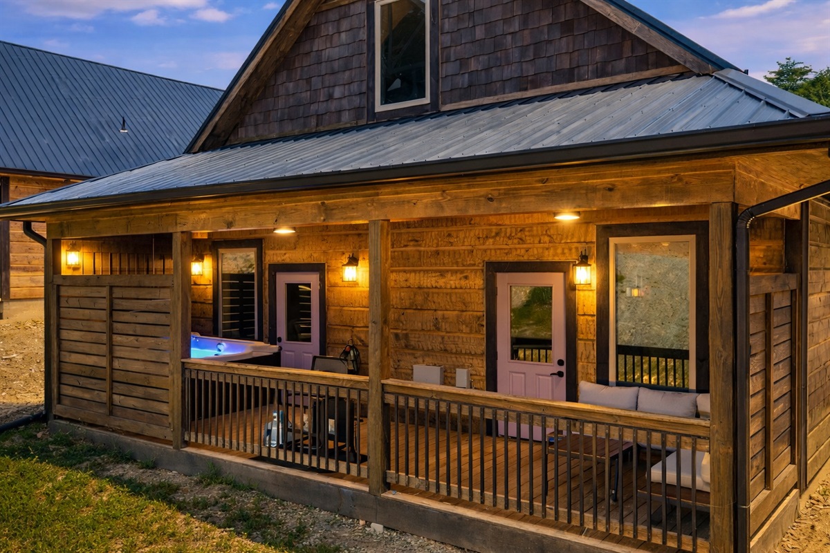 Back porch includes gas, grill, sectional sofa, and hot tub.