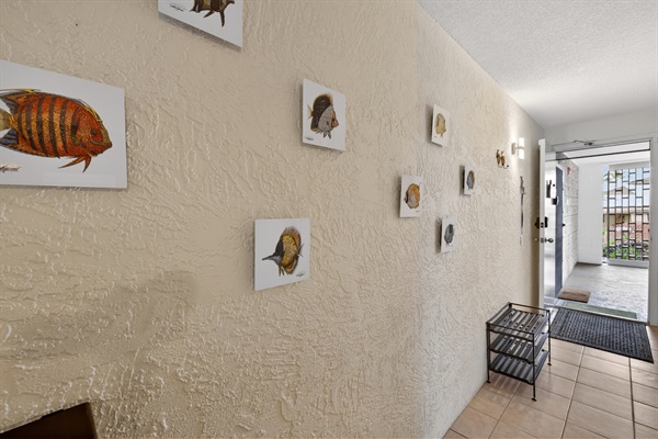Hallway accented with artwork by our favourite local Kona artist and friend, Alex Gupton—one of the small touches that gives the home its island feel. His gallery is just a 15-minute walk into the village if you’d like to see more of his work.