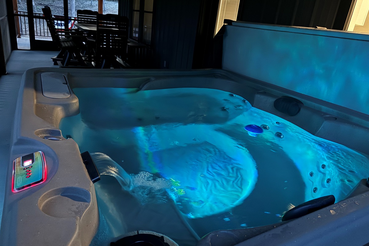 Sit in the four-person hot tub surrounded by a wooded lot and enjoy the sights and sounds of nature bug-free on the screened-in porch.