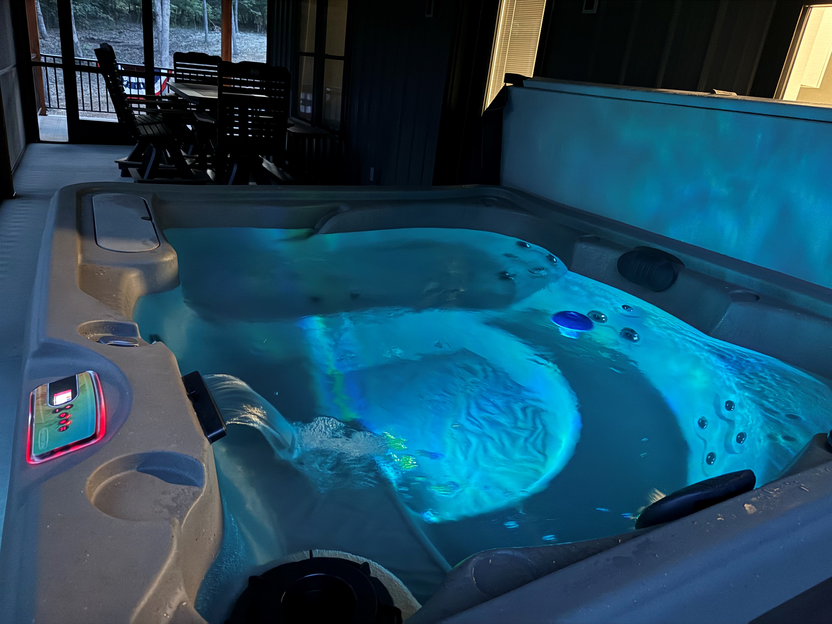 Sit in the four-person hot tub surrounded by a wooded lot and enjoy the sights and sounds of nature bug-free on the screened-in porch.