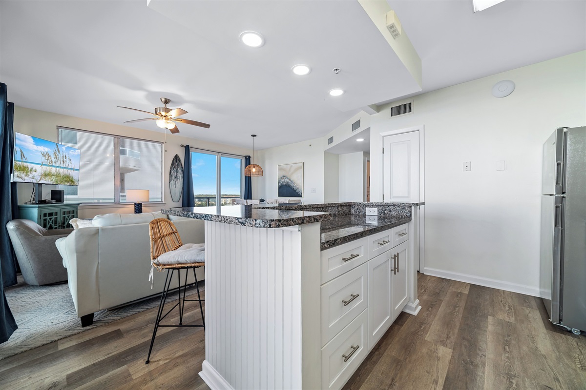 Beautiful stocked kitchen with Stainless appliances, granite tops and tiled backsplash! 