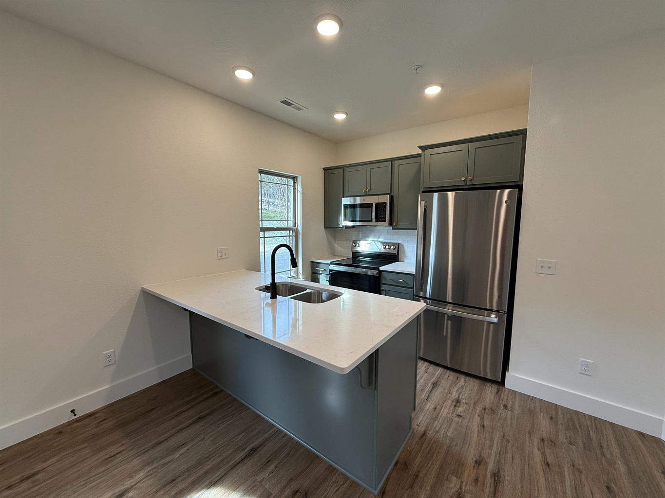 Gourmet kitchen stocked cooking meals together