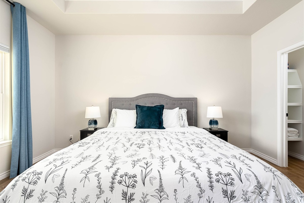 Master bedrom with a king size bed. The cordless  blinds can allow you to slide the blind from the top and or bottom to change the amount of outdoor lighting you desire and  privacy.